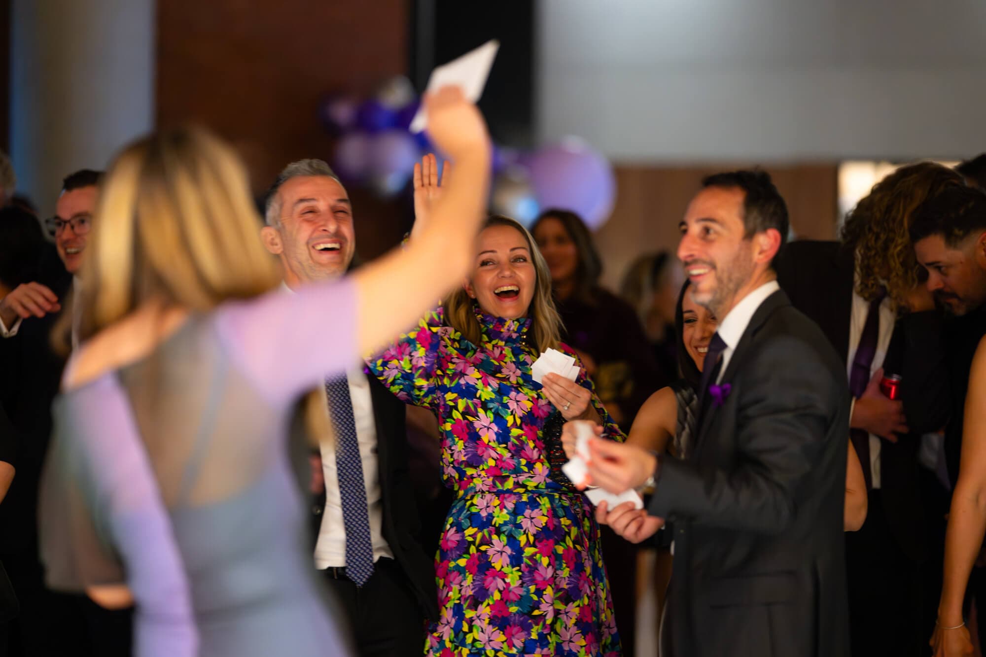 Guests laughing together on the dance floor